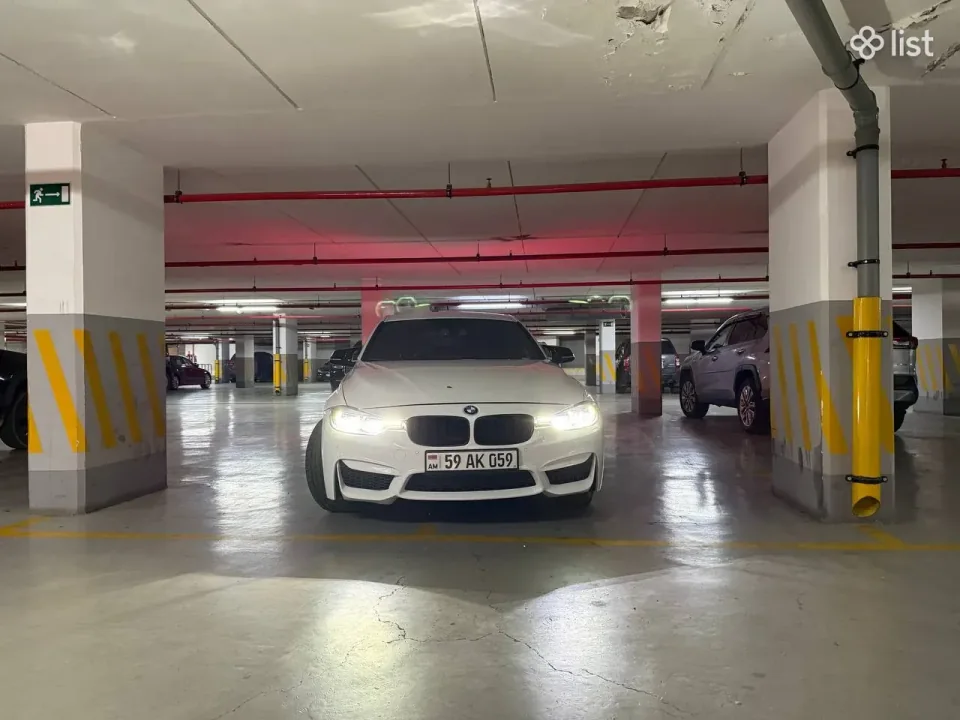 White BMW F30 sedan, front view
